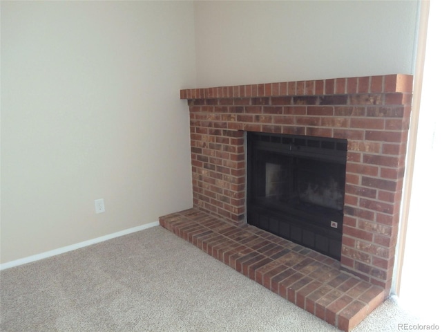 2215 S Buckley Rd Unit 201, Aurora, CO 80013 - detailed view of a fireplace, carpet flooring, and baseboards