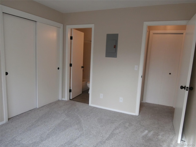 2215 S Buckley Rd Unit 201, Aurora, CO 80013 - unfurnished bedroom with electric panel, carpet floors, and connected bathroom