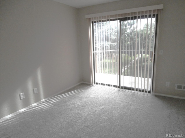 2215 S Buckley Rd Unit 201, Aurora, CO 80013 - carpeted empty room featuring baseboards