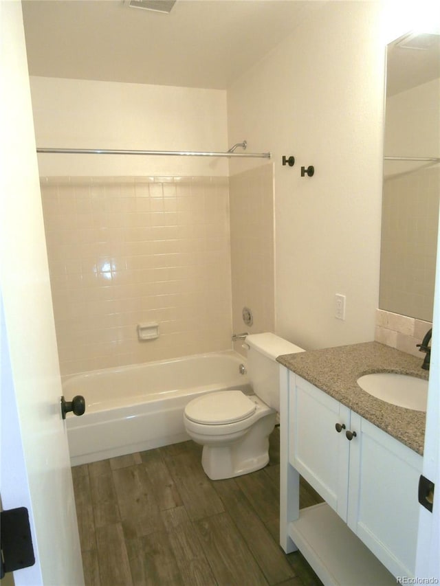 2215 S Buckley Rd Unit 201, Aurora, CO 80013 - full bath with wood finished floors, vanity,  shower combination, and toilet