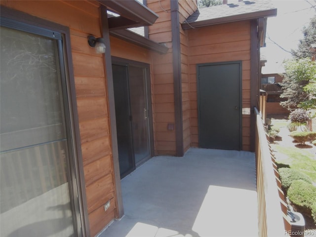 2215 S Buckley Rd Unit 201, Aurora, CO 80013 - doorway to property with roof with shingles