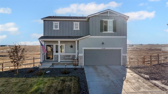 view of front of home featuring a garage and covered porch