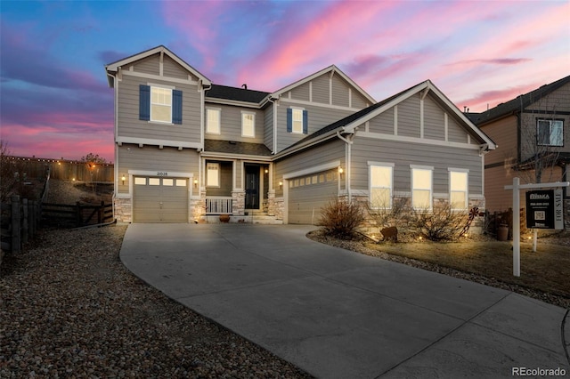 21028 E Saratoga Ave, Aurora, CO 80015 - craftsman house with concrete driveway, stone siding, and an attached garage