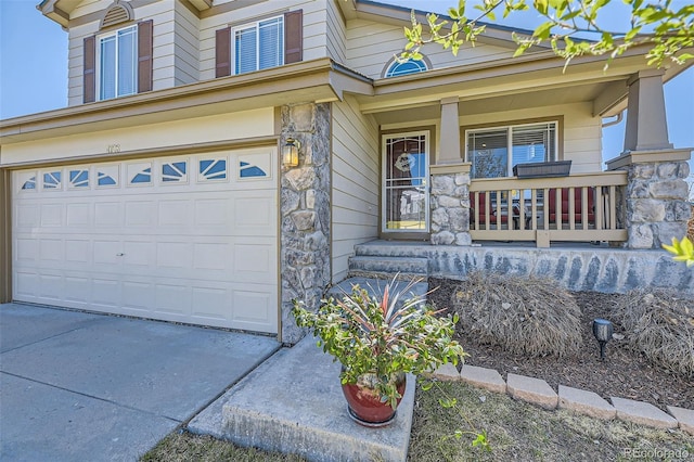 4708 Rock Pipit Ct, Highlands Ranch, CO 80126 - view of front of home with covered porch, stone siding, a garage, and driveway