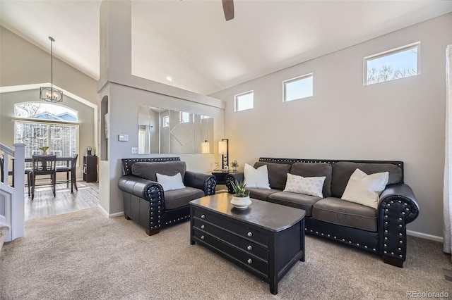 4708 Rock Pipit Ct, Highlands Ranch, CO 80126 - living room with light carpet, high vaulted ceiling, baseboards, and a ceiling fan