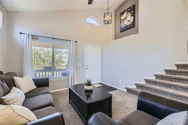 4708 Rock Pipit Ct, Highlands Ranch, CO 80126 - living room with dark carpet, baseboards, stairway, and high vaulted ceiling