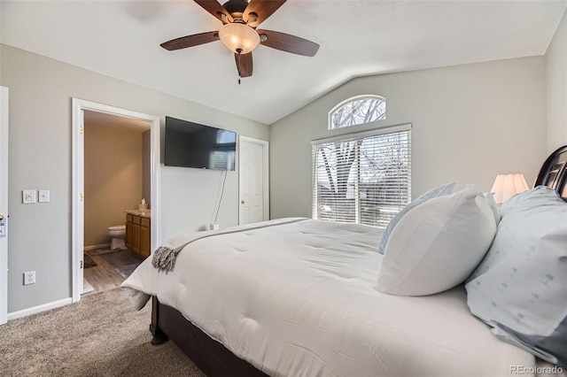4708 Rock Pipit Ct, Highlands Ranch, CO 80126 - bedroom featuring vaulted ceiling, baseboards, connected bathroom, a ceiling fan, and light carpet