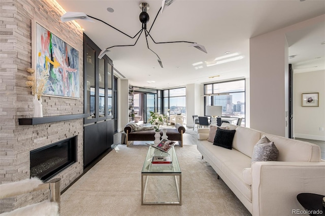 living area with a stone fireplace