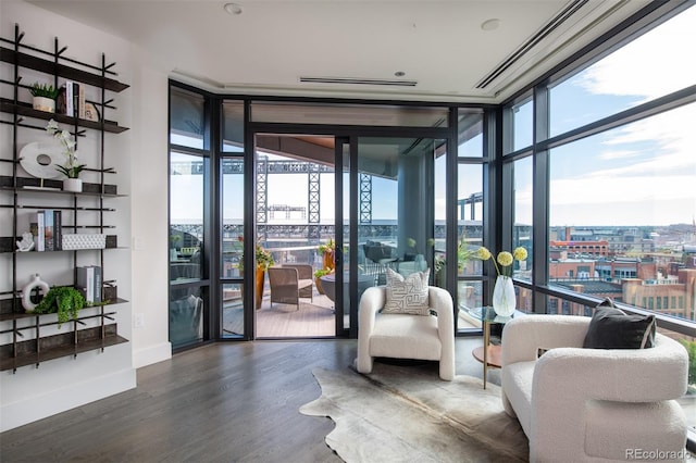 building lobby with a view of city and a sunroom