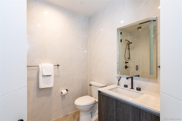 full bath featuring toilet, walk in shower, tile walls, and vanity