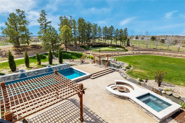 view of pool with a lawn, an in ground hot tub, and a patio area