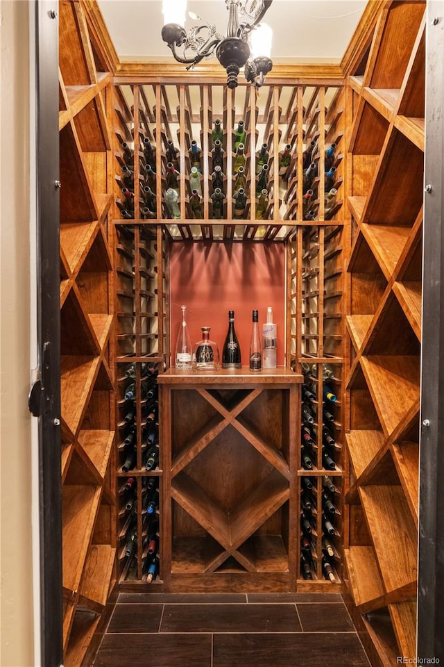 wine room featuring a chandelier