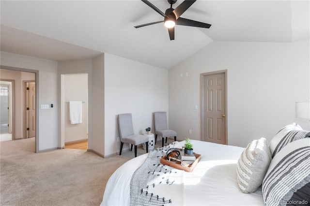 bedroom featuring light carpet, vaulted ceiling, baseboards, and ceiling fan