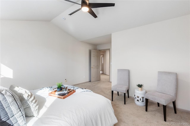 bedroom featuring a ceiling fan, lofted ceiling, light carpet, and baseboards