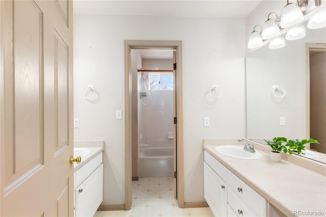 full bath with vanity, baseboards, tub / shower combination, and tile patterned floors