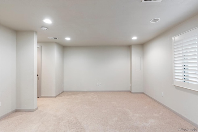 interior space with recessed lighting, light colored carpet, visible vents, and baseboards