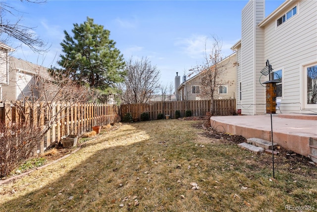 view of yard with a fenced backyard and a patio