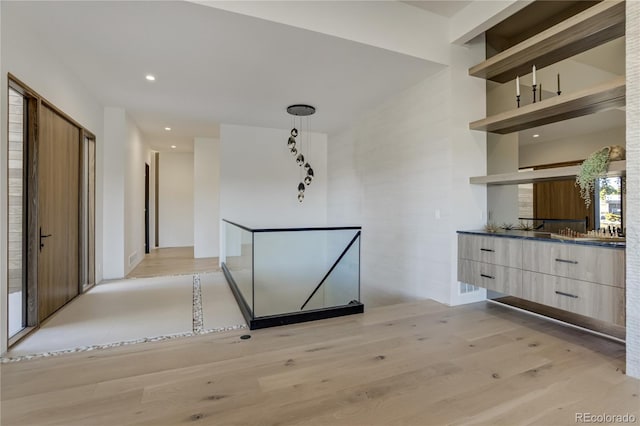 hall featuring recessed lighting and light wood finished floors