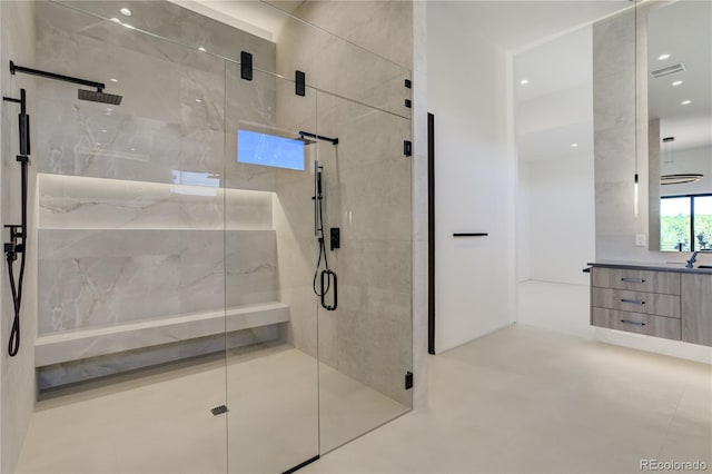 bathroom featuring a stall shower, visible vents, and vanity