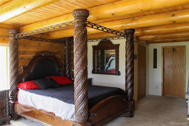 160 Nuthatch Dr, Cotopaxi, CO 81223 - bedroom with beamed ceiling, carpet flooring, log walls, and wooden ceiling