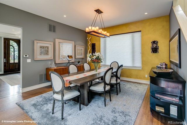 460 N Garfield St, Denver, CO 80206 - dining room featuring wood finished floors, recessed lighting, and a chandelier