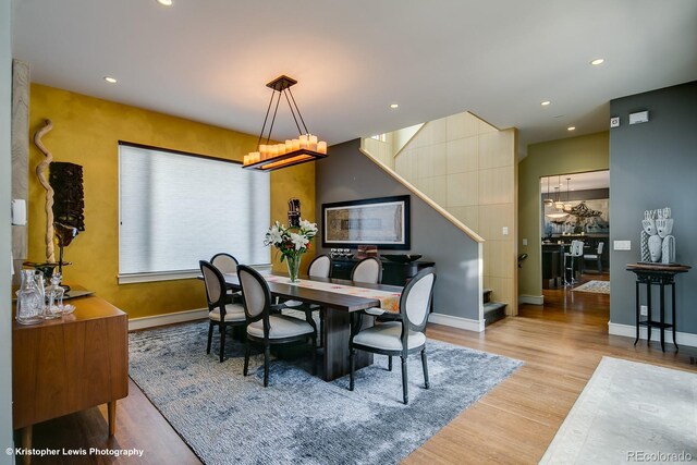 460 N Garfield St, Denver, CO 80206 - dining room featuring a chandelier, wood finished floors, recessed lighting, and stairs