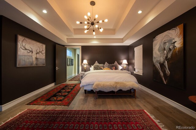 460 N Garfield St, Denver, CO 80206 - bedroom with a chandelier, a raised ceiling, wood finished floors, and recessed lighting