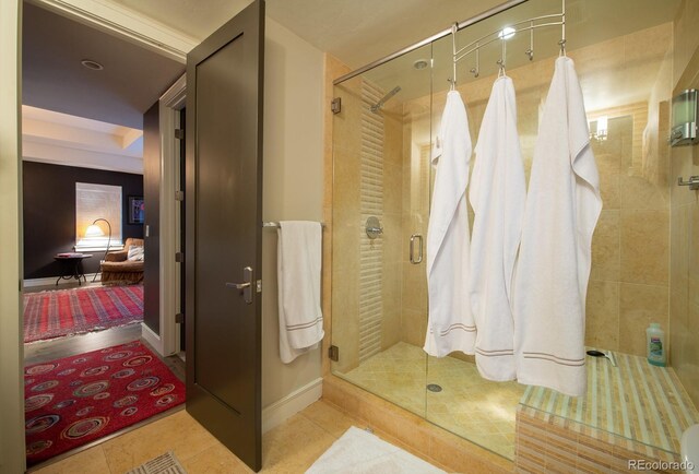 460 N Garfield St, Denver, CO 80206 - full bathroom with a shower stall and tile patterned floors