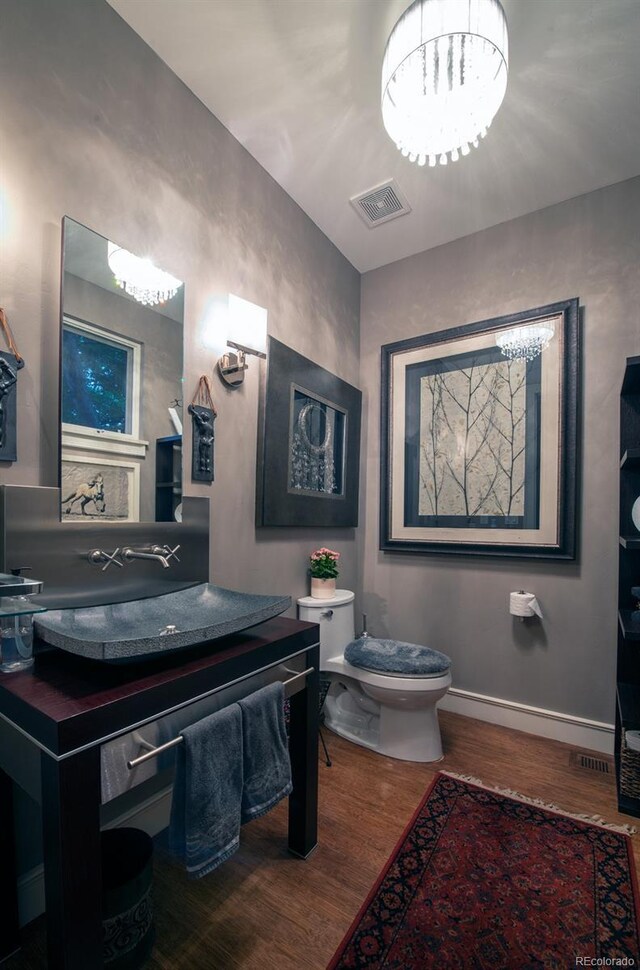 460 N Garfield St, Denver, CO 80206 - bathroom featuring wood finished floors and vanity