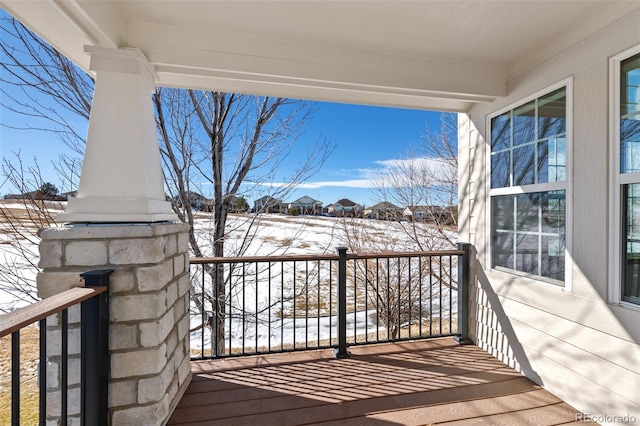 view of snow covered deck