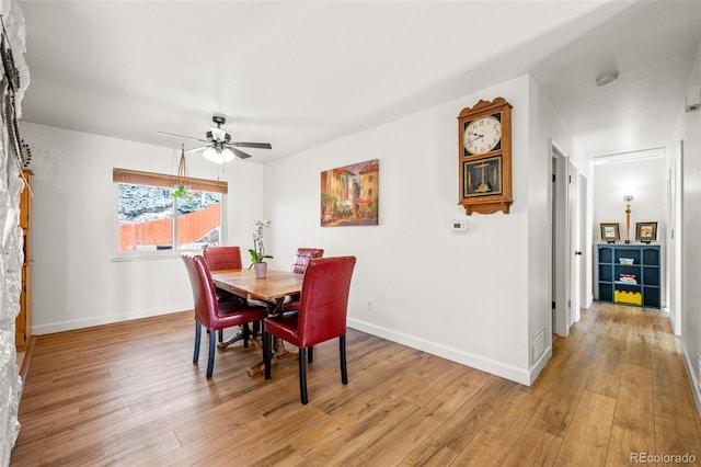 dining area with ceiling fan, wood finished floors, and baseboards