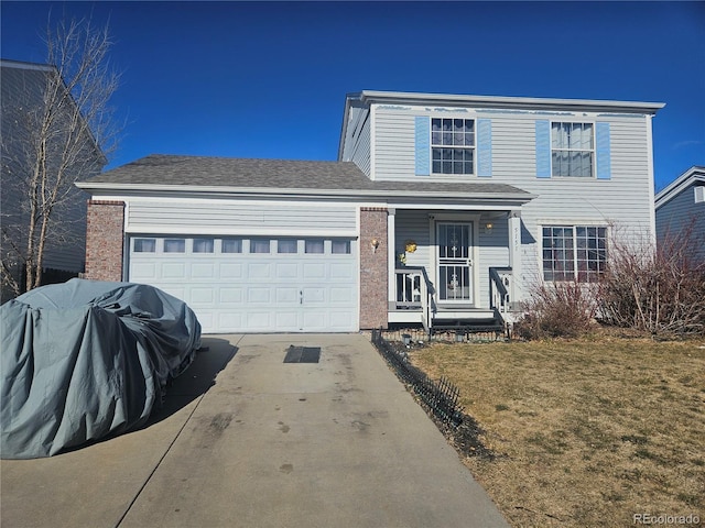 front of property with a front lawn and a garage