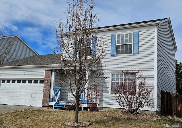 traditional home with an attached garage, concrete driveway, and fence