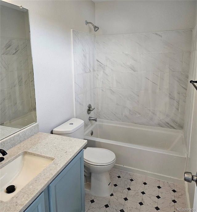 bathroom with vanity, toilet, and washtub / shower combination