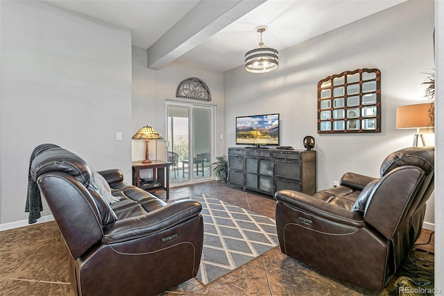 living room with beamed ceiling