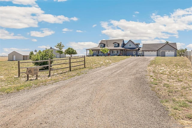 view of front of home with a garage and a front lawn