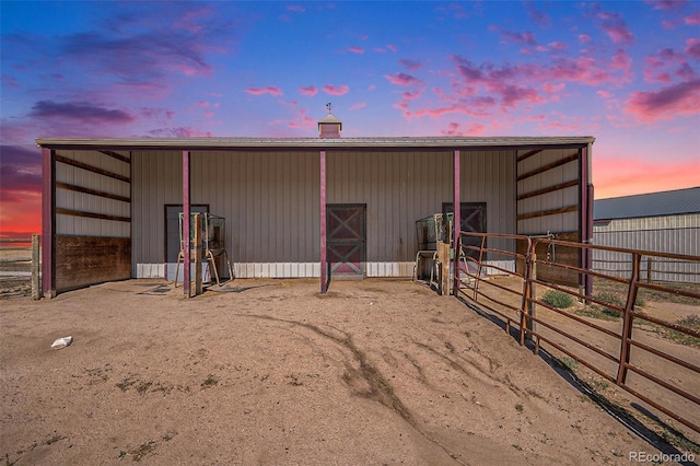 view of outdoor structure at dusk