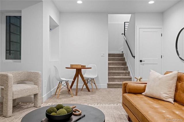 living area featuring carpet floors