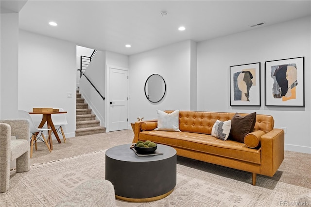 living room featuring light carpet