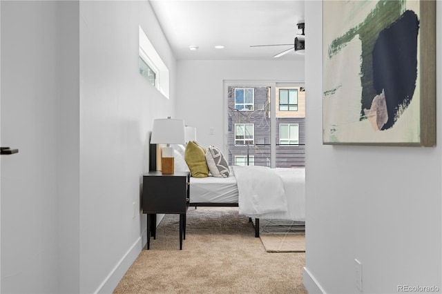 carpeted bedroom with ceiling fan