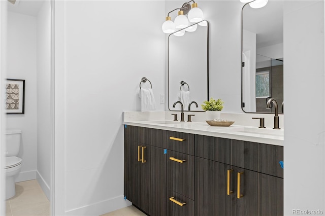 bathroom featuring vanity, tile patterned flooring, and toilet