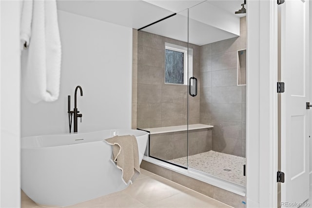 bathroom featuring walk in shower and tile patterned floors