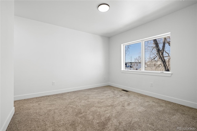 spare room featuring carpet flooring