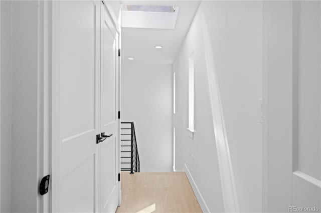 hallway with light wood-type flooring