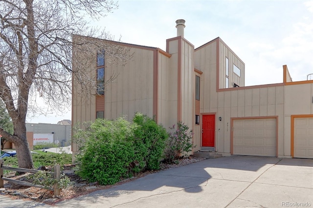 view of front of home featuring concrete driveway and an attached garage