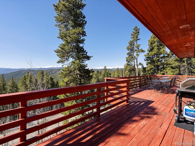 451 Harris Dr, Idaho Springs, CO 80452 - wooden terrace with a mountain view and outdoor dining space