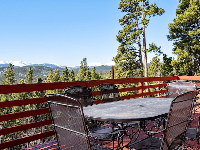 451 Harris Dr, Idaho Springs, CO 80452 - wooden deck featuring outdoor dining area and a mountain view