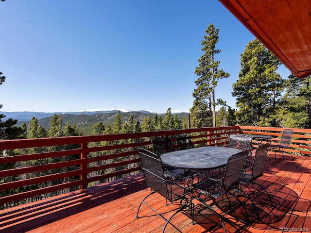451 Harris Dr, Idaho Springs, CO 80452 - wooden terrace featuring outdoor dining area and a mountain view