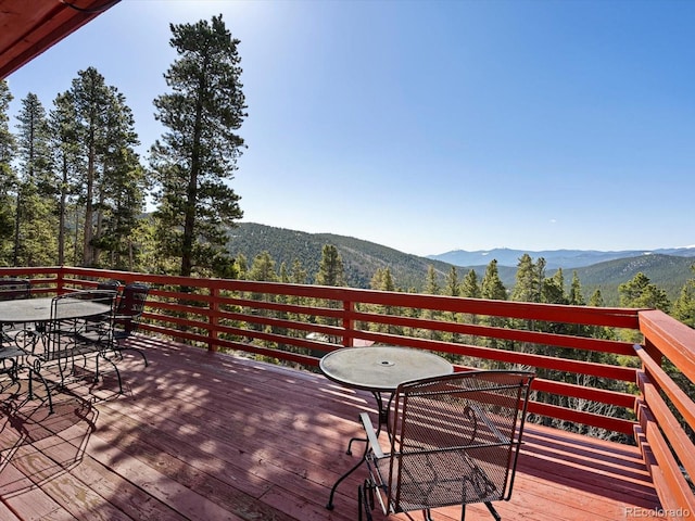 451 Harris Dr, Idaho Springs, CO 80452 - wooden deck featuring outdoor dining area and a mountain view
