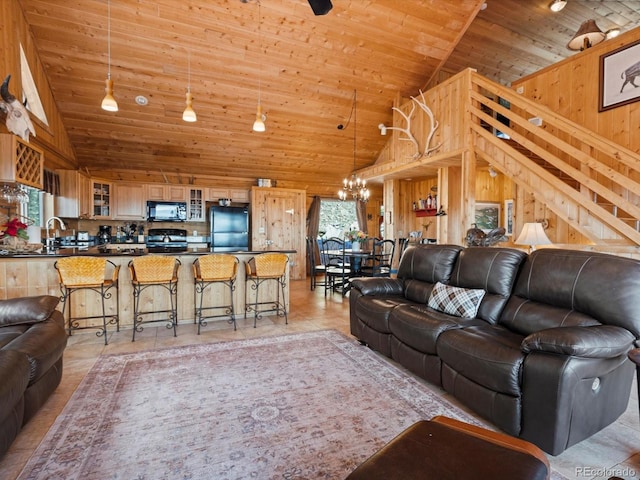 451 Harris Dr, Idaho Springs, CO 80452 - living area featuring wood ceiling, a chandelier, high vaulted ceiling, and stairs
